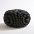 Okrągła czarna pufa z grubo plecionej dzianiny 50 x 35 cm